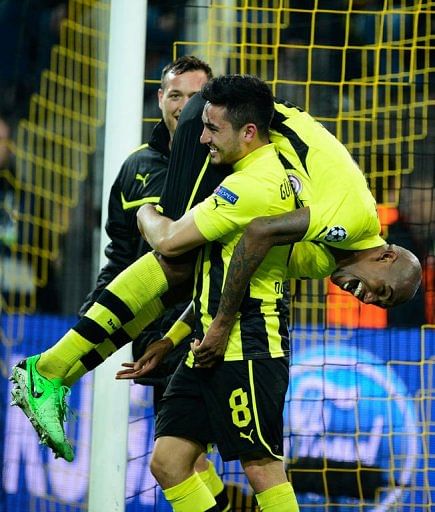Dortmund's Felipe Santana celebrates scoring the winning goal with his teammate Ilkay Guendogan on April 9, 2013